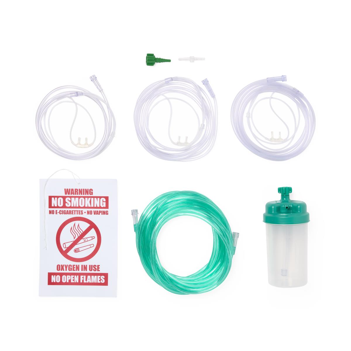 Oxygen therapy kit with three nasal cannulas, green extension tubing, humidifier bottle, flow restrictor, and no smoking