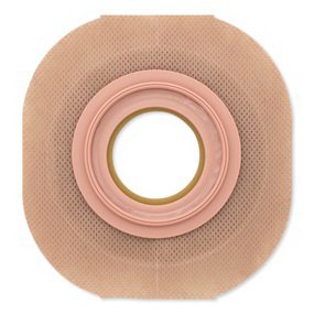 Ostomy barrier wafer with precut opening, extended wear tape border, and red-coded coupling ring on beige skin-tone adhesive
