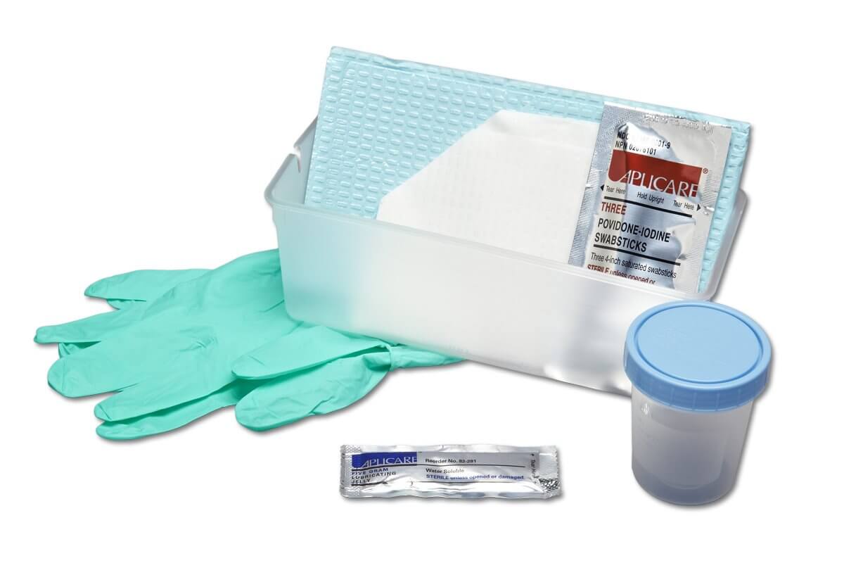 Urethral catheterization tray kit with green gloves, specimen cup, povidone-iodine swabsticks, lubricating jelly packet, and