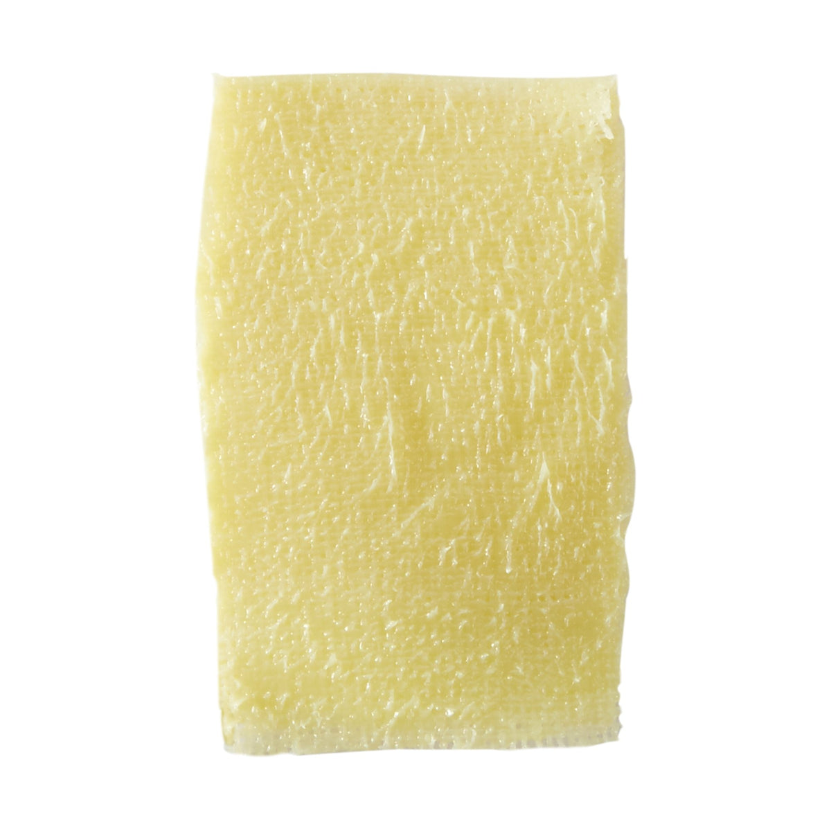 Xeroform petrolatum dressing strip with yellow-tinted fine mesh gauze texture on white background