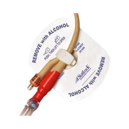 Foley catheter stabilization device with adhesive pad securing tubing and red luer connector, labeled remove with alcohol