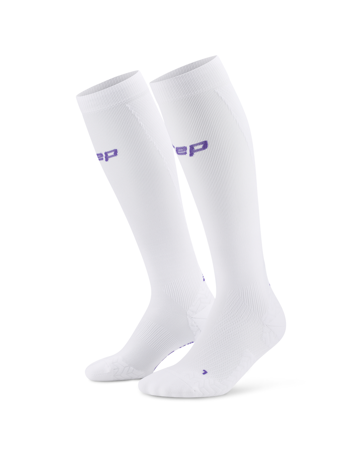 Pair of women's knee-high compression socks in white with purple logo lettering, shown on white background