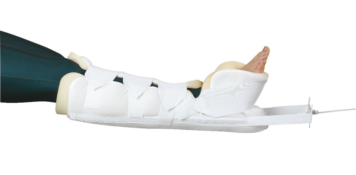 Bucks traction boot with attached spreader bar secured to a lower leg, shown in white with foam padding and hook-and-loop