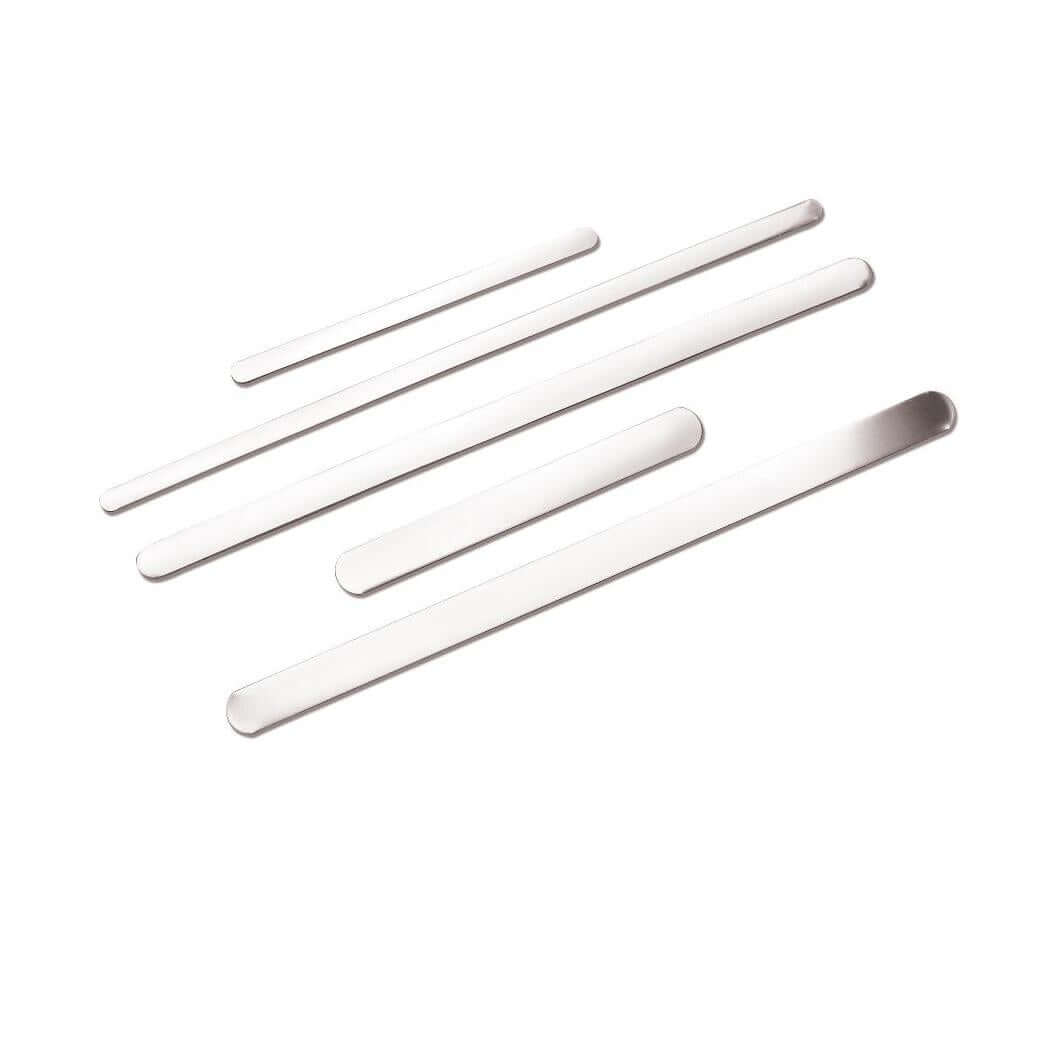 Finger splints, five flat white aluminum strips with rounded ends arranged loosely on a white background