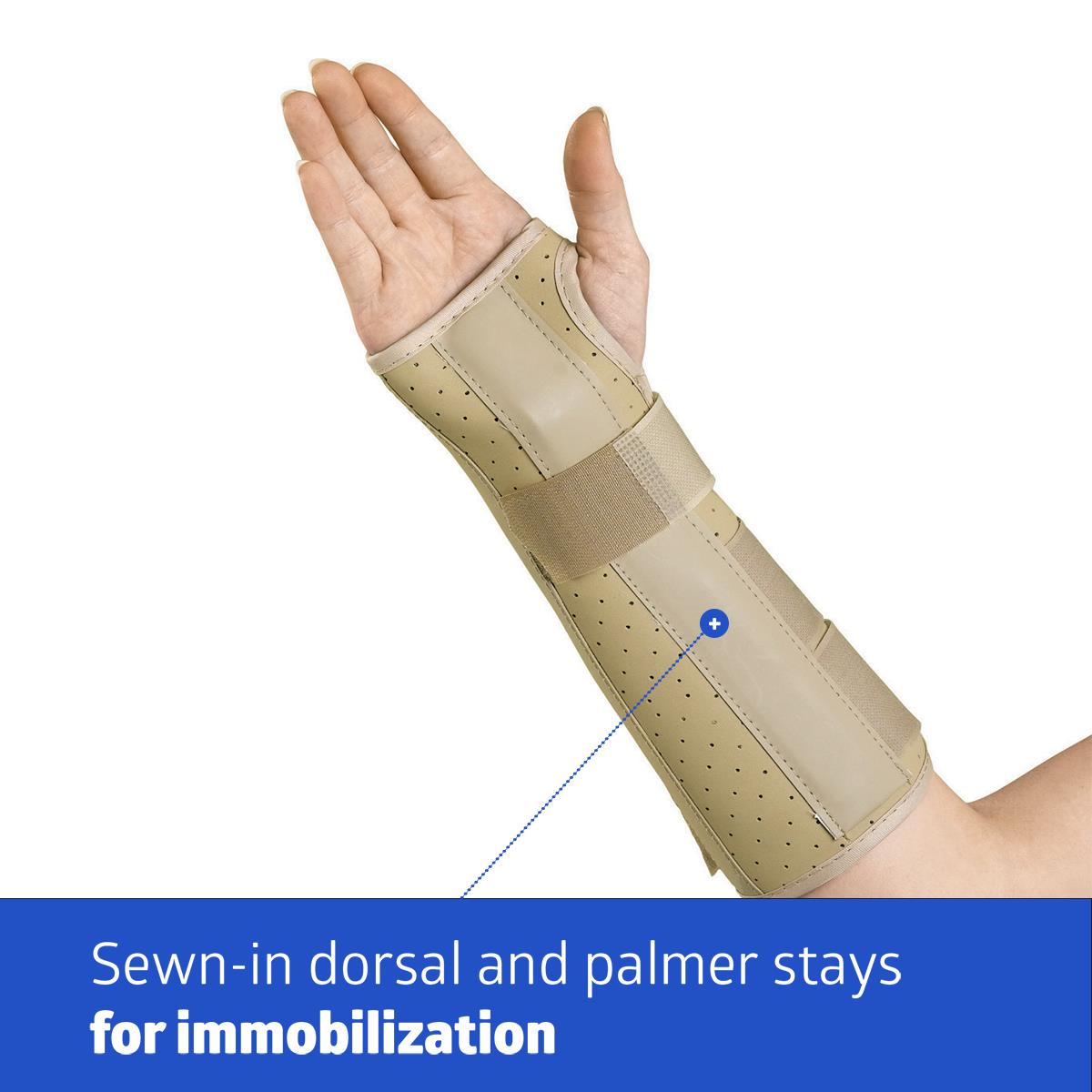 Vinyl wrist and forearm splint in beige worn on right arm, with perforated panels and hook-and-loop straps