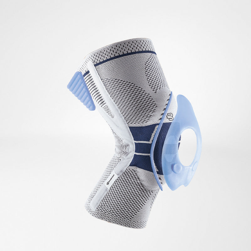 Knee brace in gray knit fabric with navy accents, blue patella pad, and side stabilizers on white background