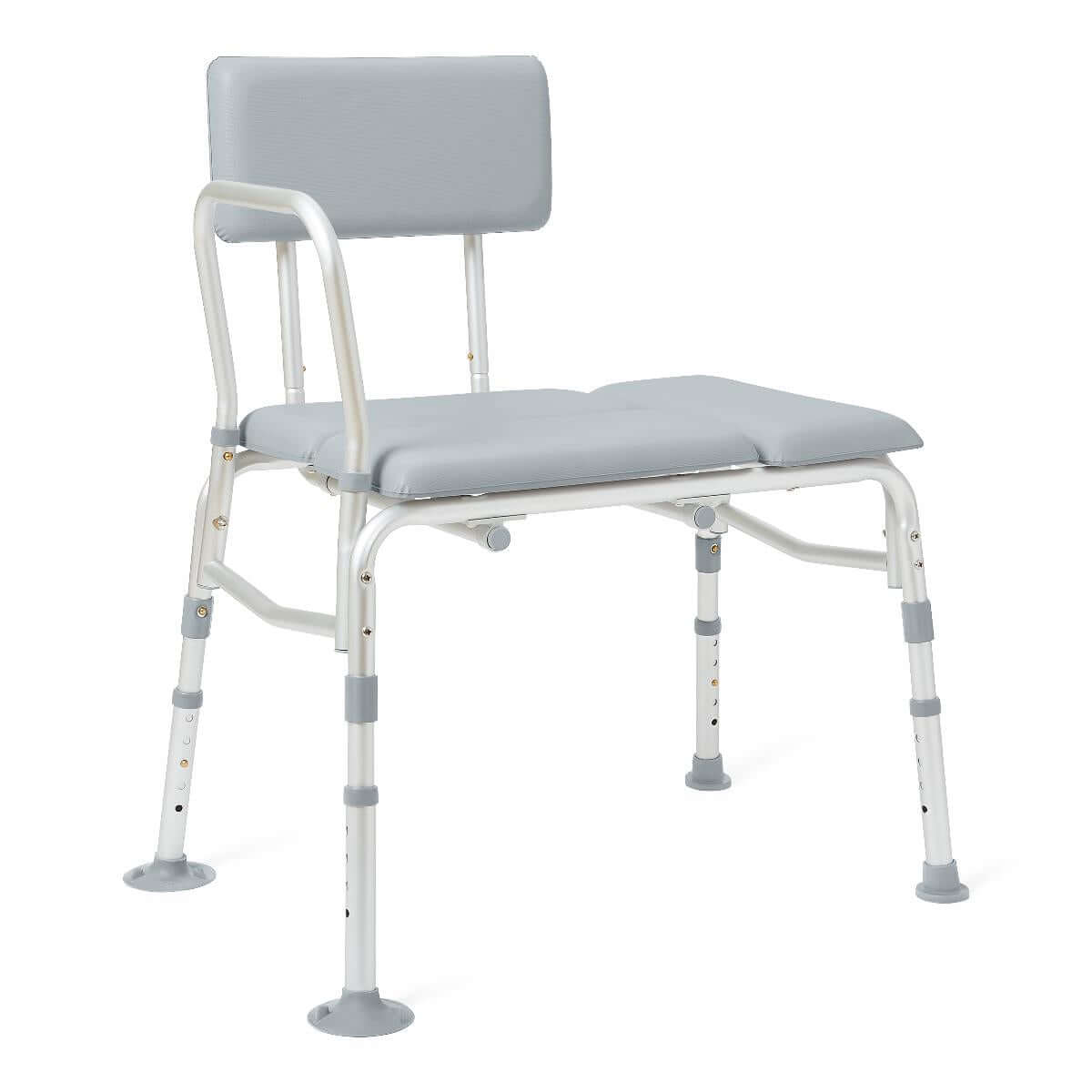Transfer bench with gray padded seat and backrest, white aluminum frame, adjustable legs, and suction cup feet