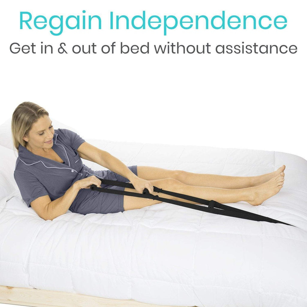 Bed ladder strap with handles used by a woman lying in bed to pull herself upright