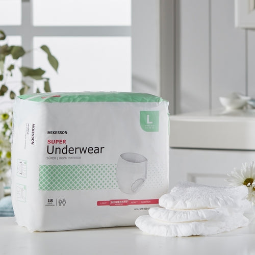 McKesson Super Underwear pull-on absorbent briefs, size large, 18-count package beside folded samples on white surface