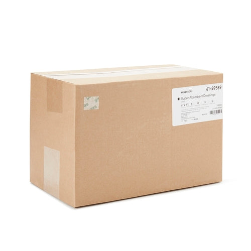 Cardboard shipping box of McKesson Super Absorbent Dressings with product label on side, sealed with tape on white background