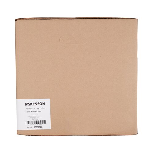 McKesson disposable underpad in sealed brown cardboard shipping box with label and barcode on white background