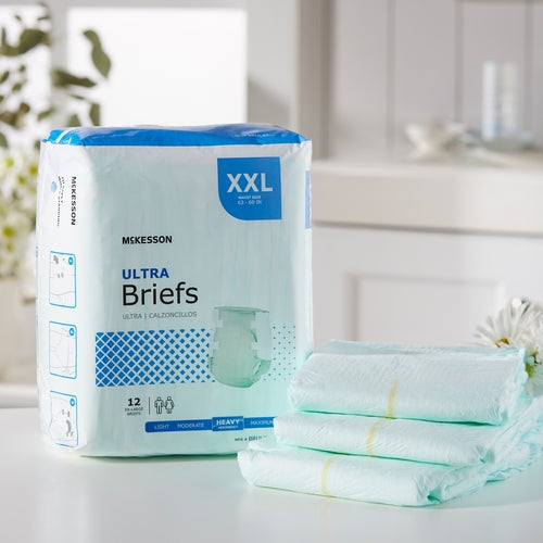 McKesson Ultra Briefs XXL incontinence brief package with folded briefs stacked beside it on a white surface