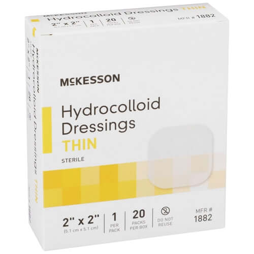 McKesson hydrocolloid dressings thin sterile box, white and yellow packaging, 2x2 inch size, 20 packs shown with sample