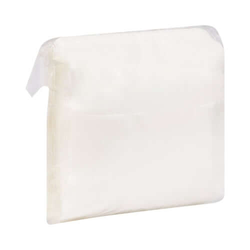 Island dressing square wound pad in clear plastic packaging, white absorbent center with transparent border visible from
