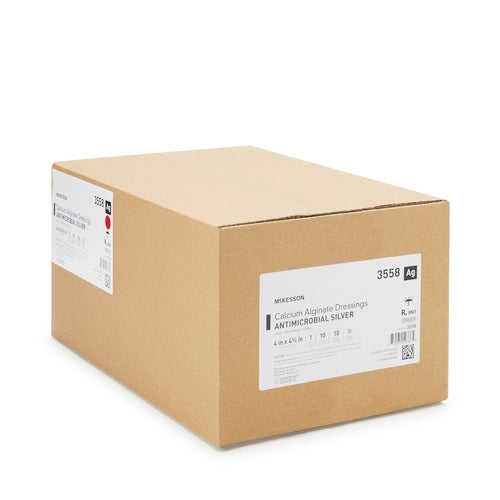 Calcium alginate antimicrobial silver dressing bulk case, tan cardboard box with white product label and red accent stripe