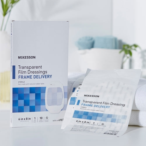 McKesson Transparent Film Dressing box and individual sterile packet displayed on white surface with soft home background