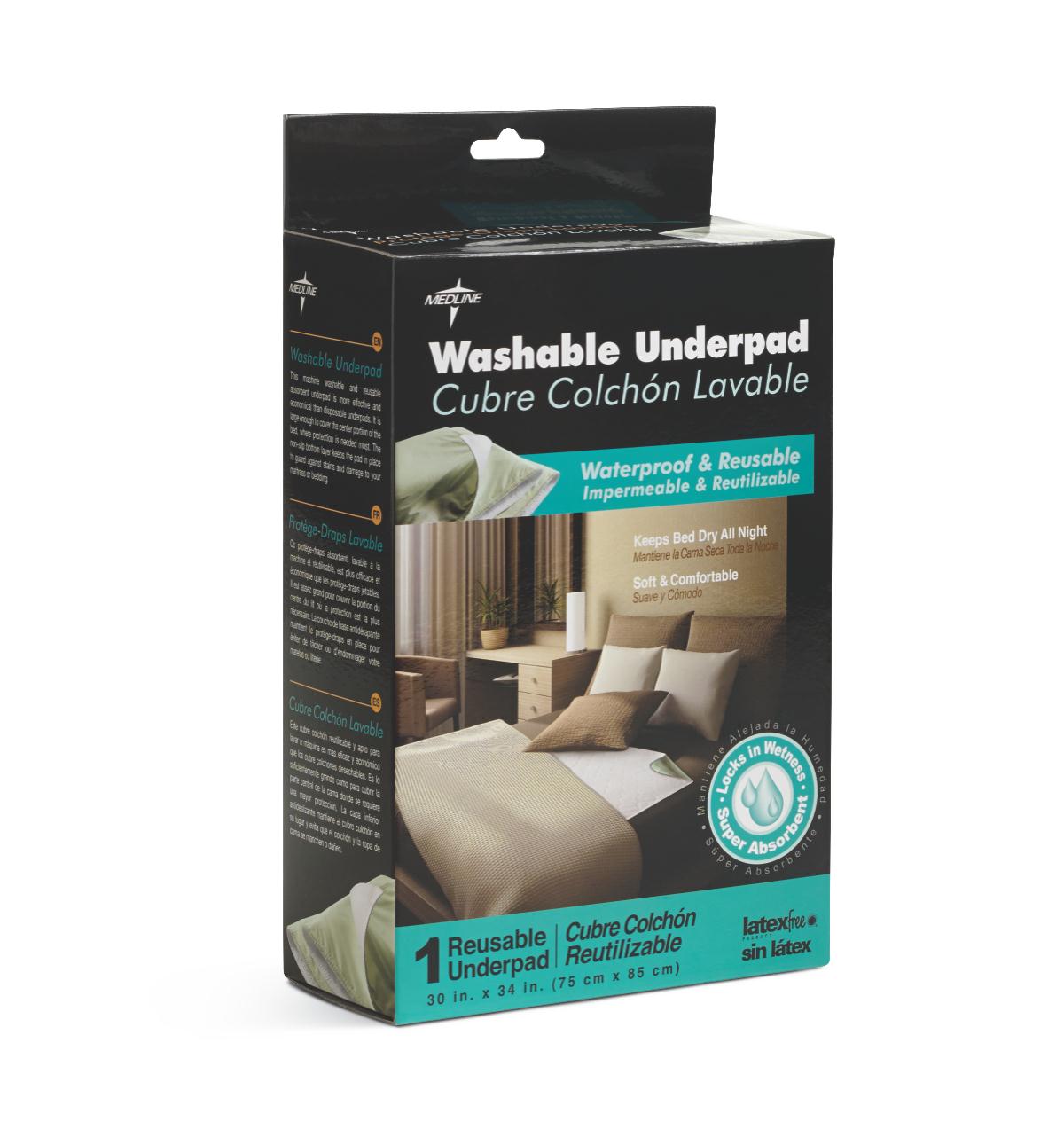 Washable reusable underpad in dark retail box with bilingual labeling, shown with bedroom setting inset image