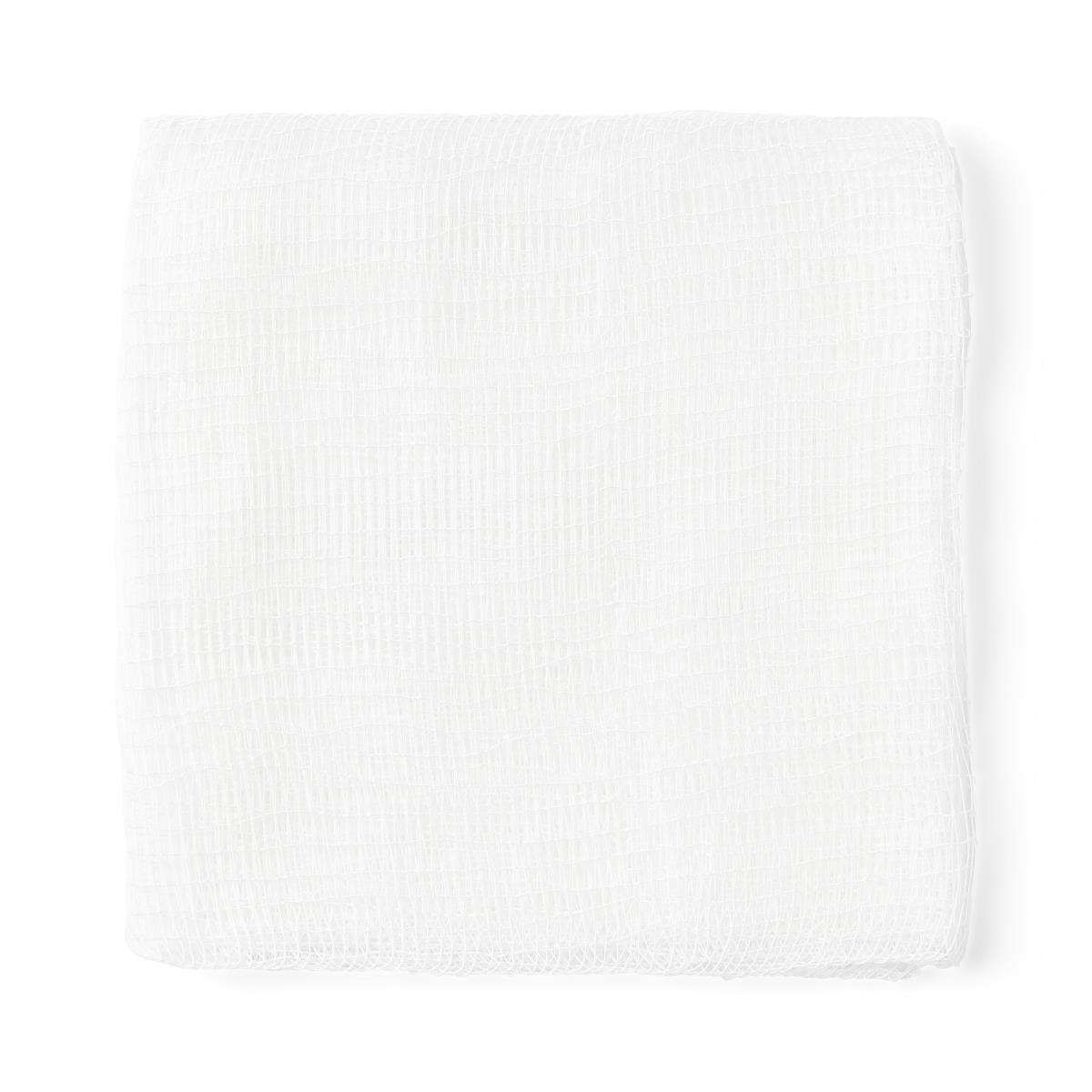 Gauze sponge folded into a square, white woven cotton mesh, multiple layers visible through open weave texture