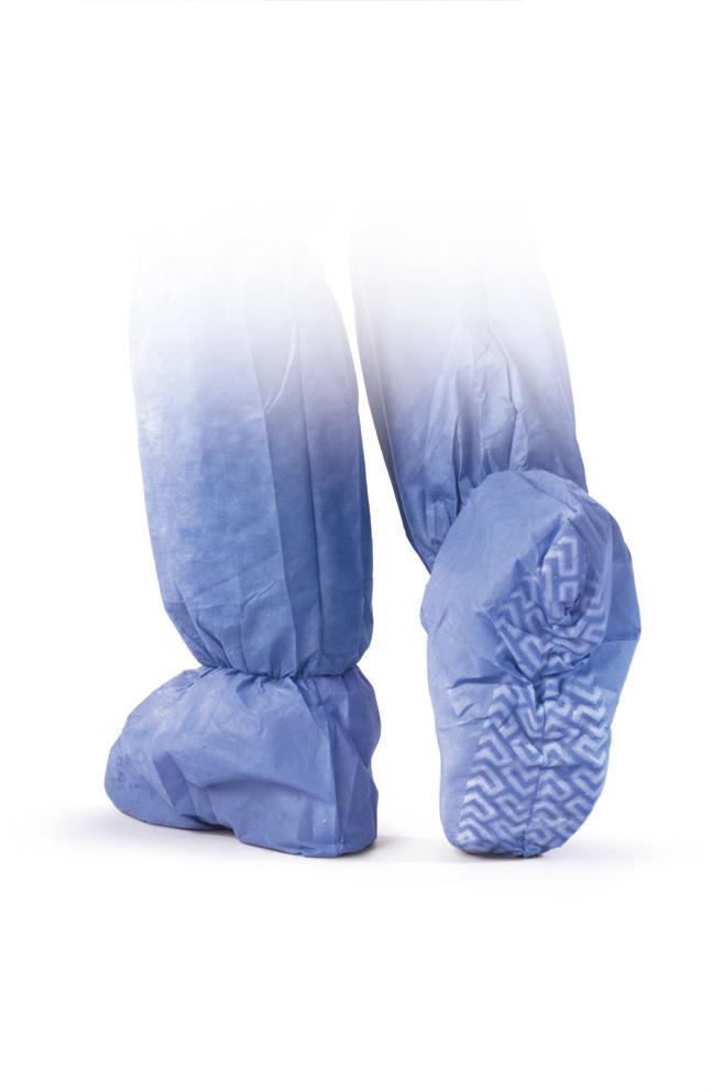 Boot covers in blue non-woven fabric worn on feet, showing non-skid textured sole pattern, with tall leg coverage