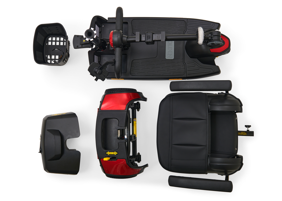 Power mobility scooter disassembled into five separate components including tiller, seat, battery pack, and body sections