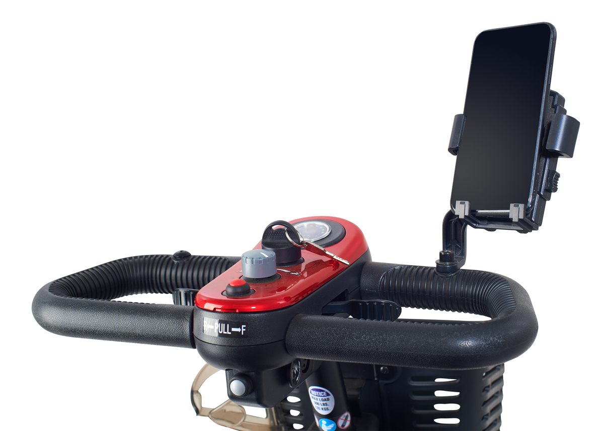 Mobility scooter tiller with red control panel, key ignition, speed dial, and adjustable phone mount holding a smartphone