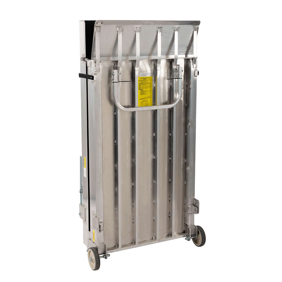 Portable wheelchair ramp system folded vertically, aluminum slatted surface with carry handle and transport wheels, yellow
