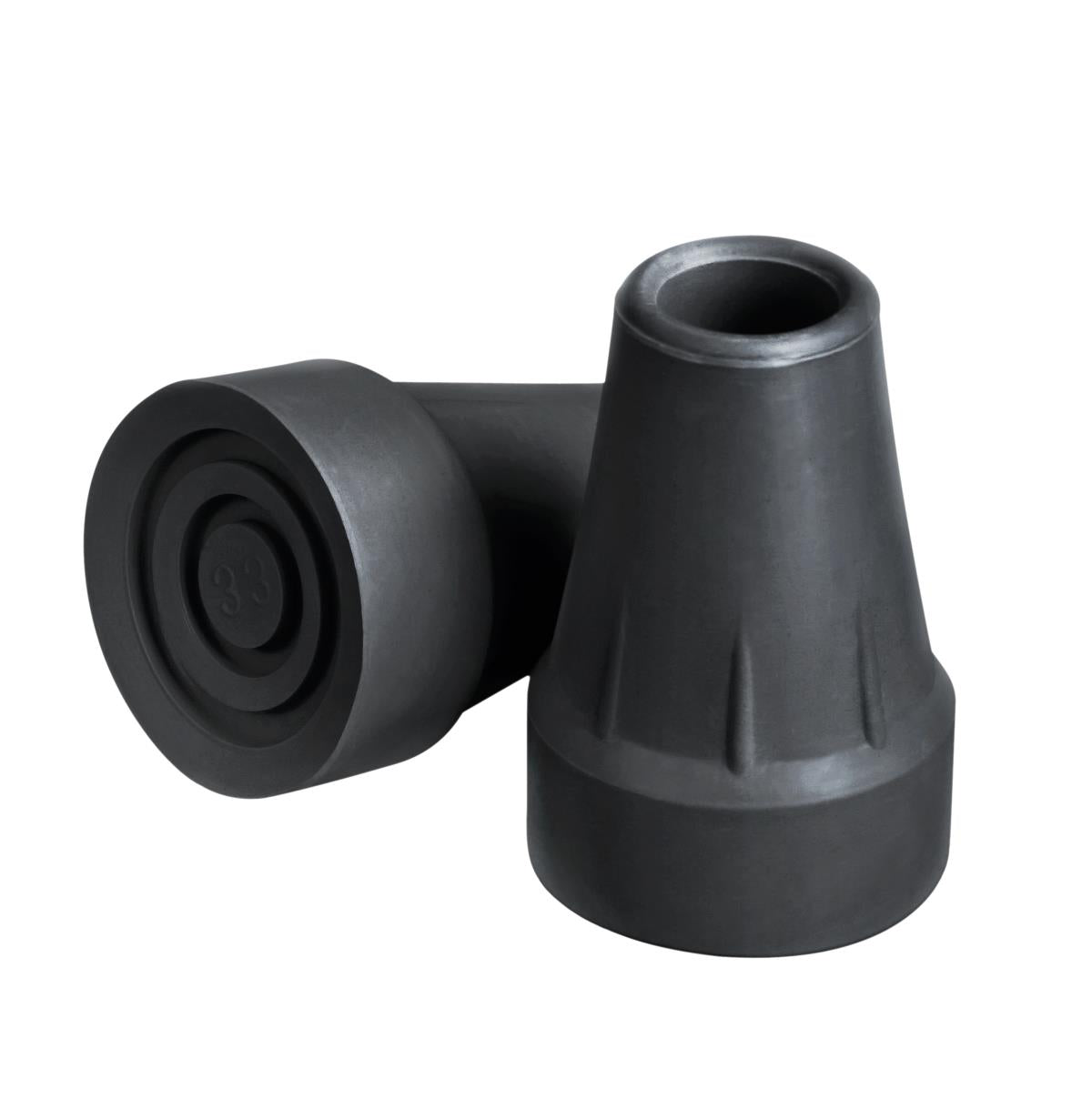 Pair of black rubber crutch tips, one upright showing hollow opening and one on its side showing ridged bottom surface