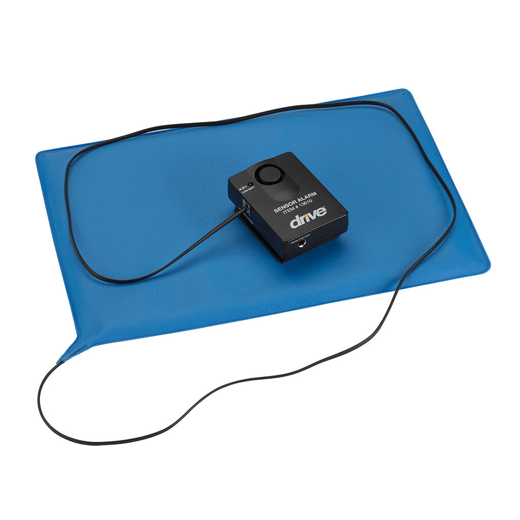 Pressure-sensitive bed and chair patient alarm mat in blue with connected black sensor alarm unit and cord