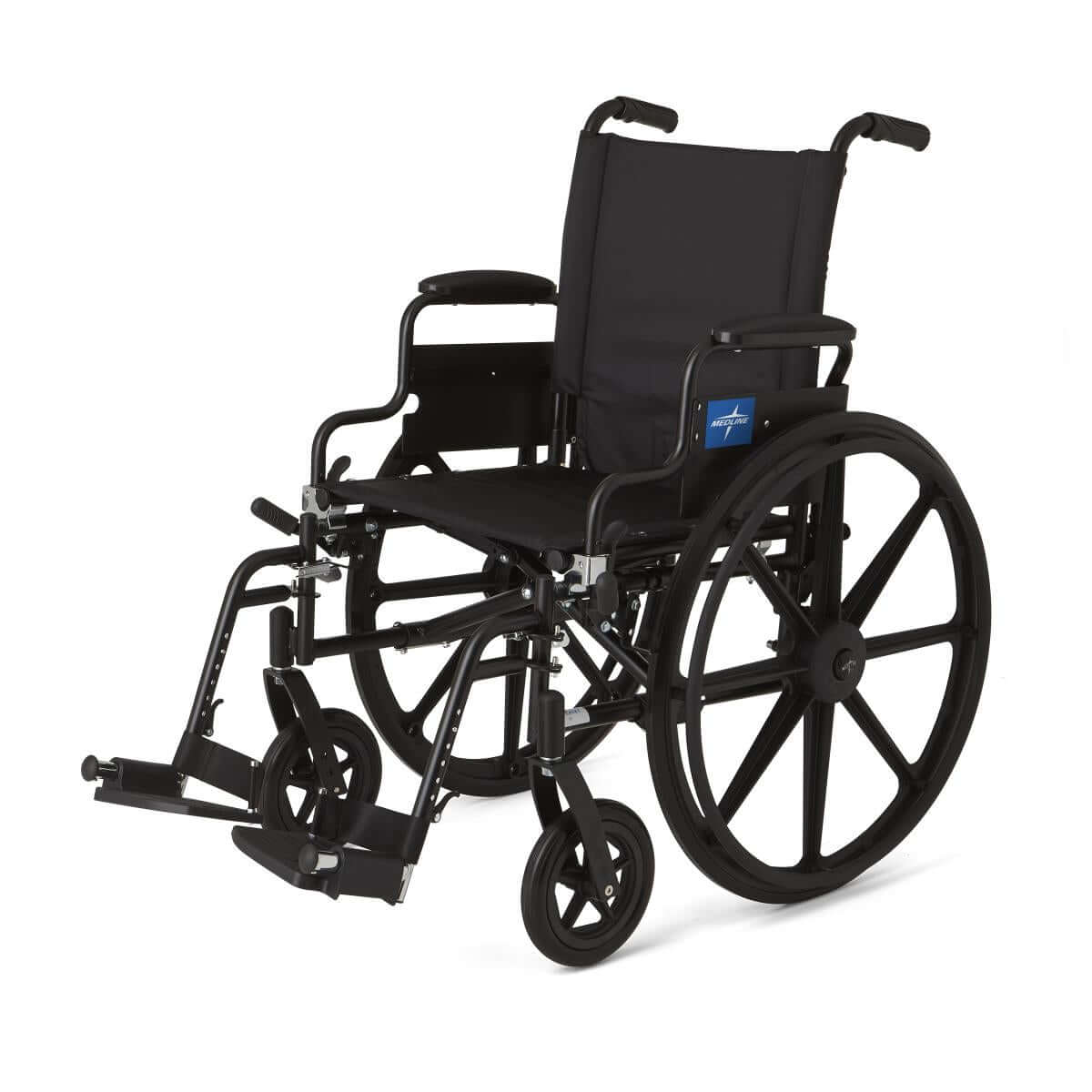 Wheelchair with black frame, padded seat and back, removable desk-length arms, swing-away footrests, and large rear wheels