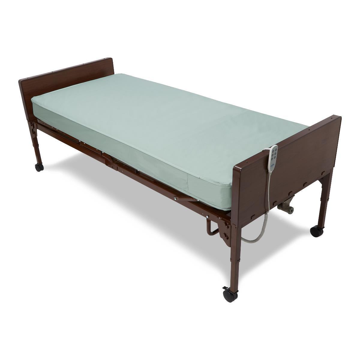 Innerspring mattress with light blue cover shown on a home hospital bed with dark wood panels and casters