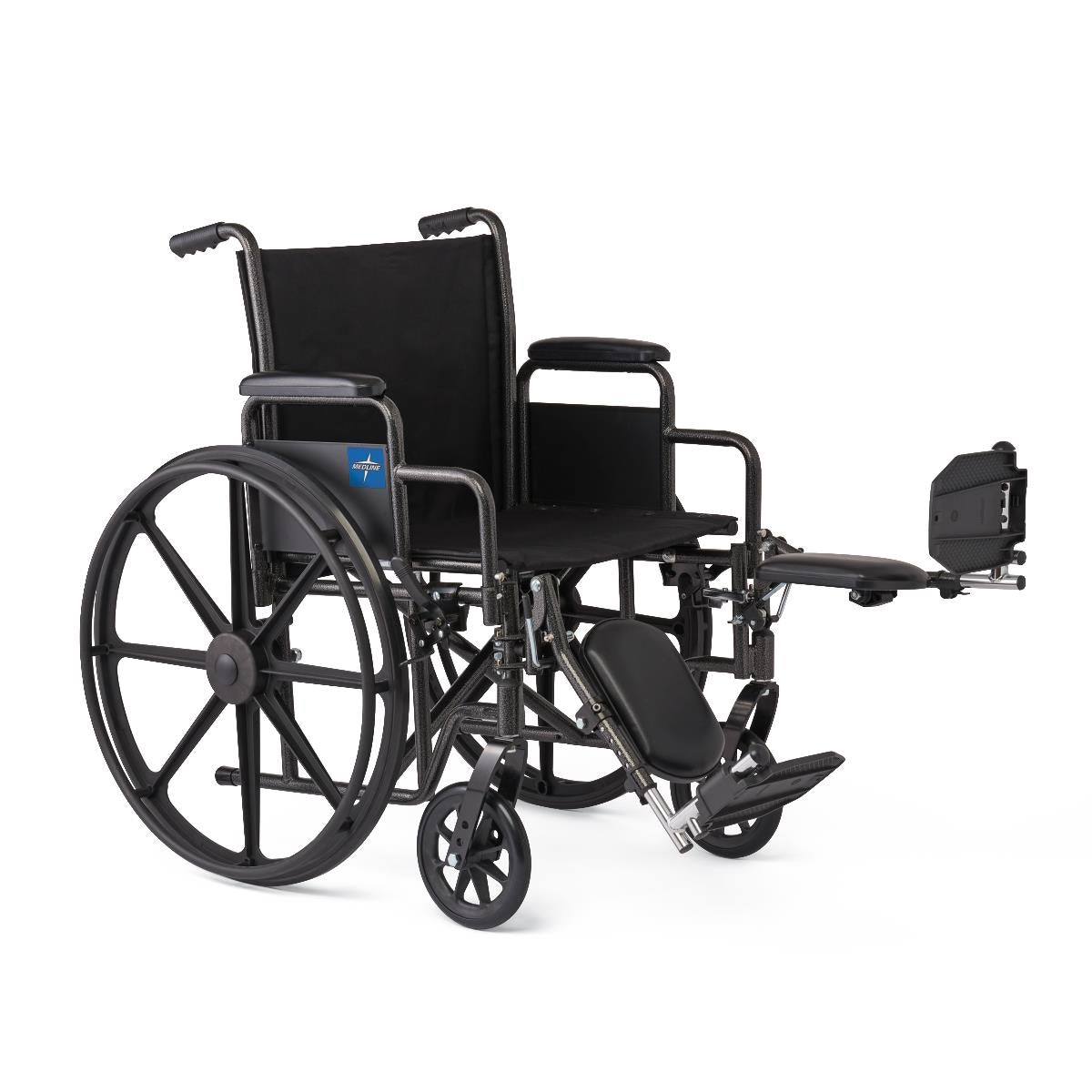 Wheelchair with black frame, removable desk-length arms, elevating leg rest extended, and large rear wheels shown at an angle