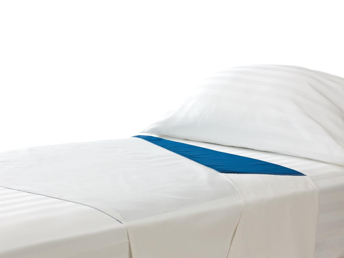 Patient positioning sheet set laid across a white hospital bed with a blue transfer strip across the center