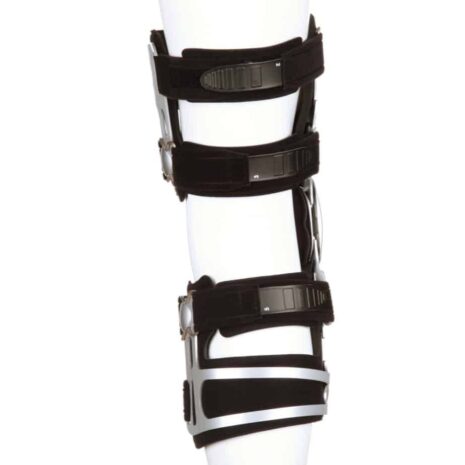 Knee brace with silver metal uprights, black padded straps, and hinged joints displayed on a leg form