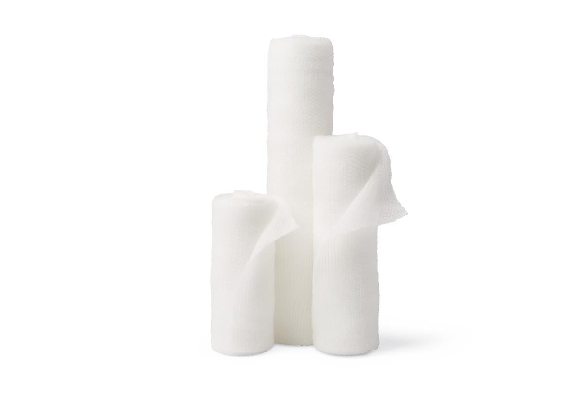 Conforming stretch gauze bandage rolls in three sizes, white, slightly unrolled, displayed together on white background