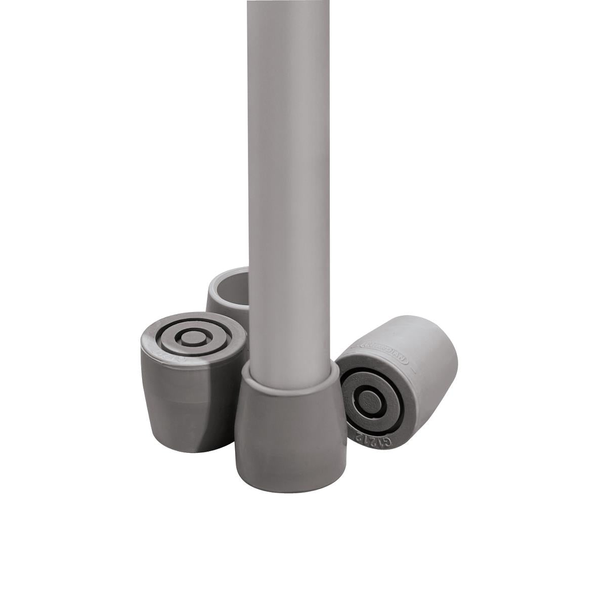 Rubber cane tips in gray shown fitted on a metal tube leg alongside two additional replacement tips with circular rubber