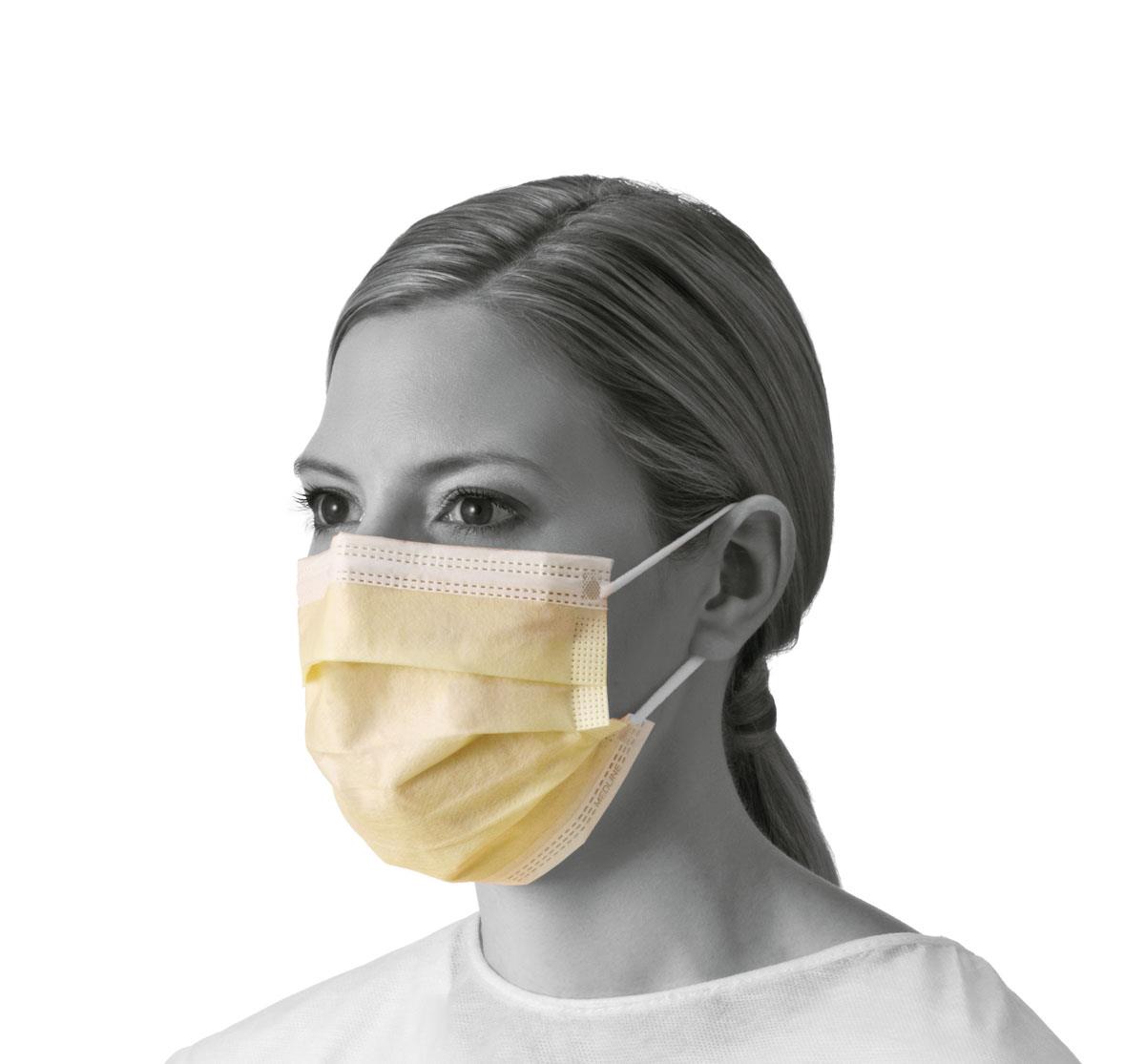 Isolation face mask in yellow with white earloops, worn by a model showing front and side fit