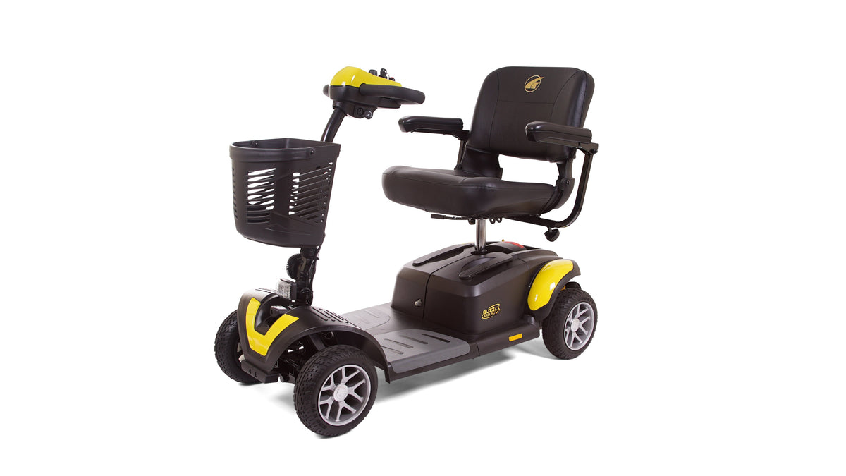 Four-wheel power mobility scooter in black and yellow with padded seat, armrests, tiller controls, and front basket