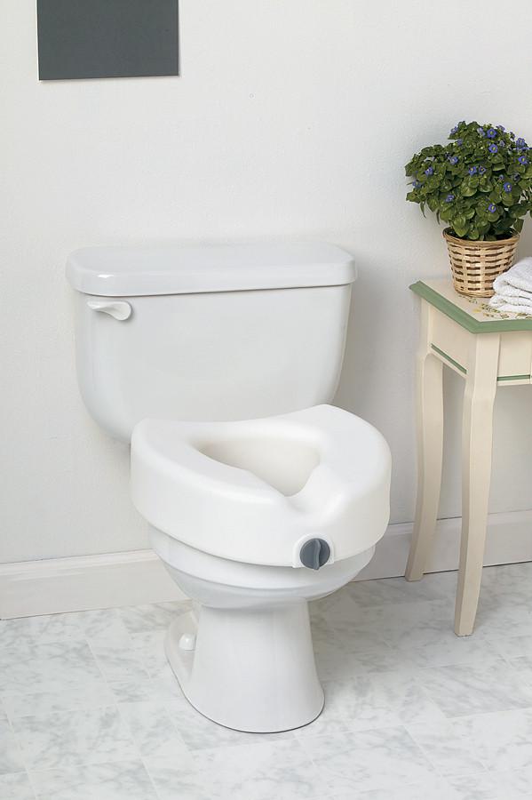 Locking raised toilet seat without arms installed on a white toilet, shown in a bathroom with marble tile flooring