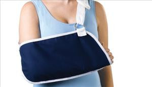 Deep pocket arm sling in navy blue with white trim, worn on a person's right arm over a light blue shirt