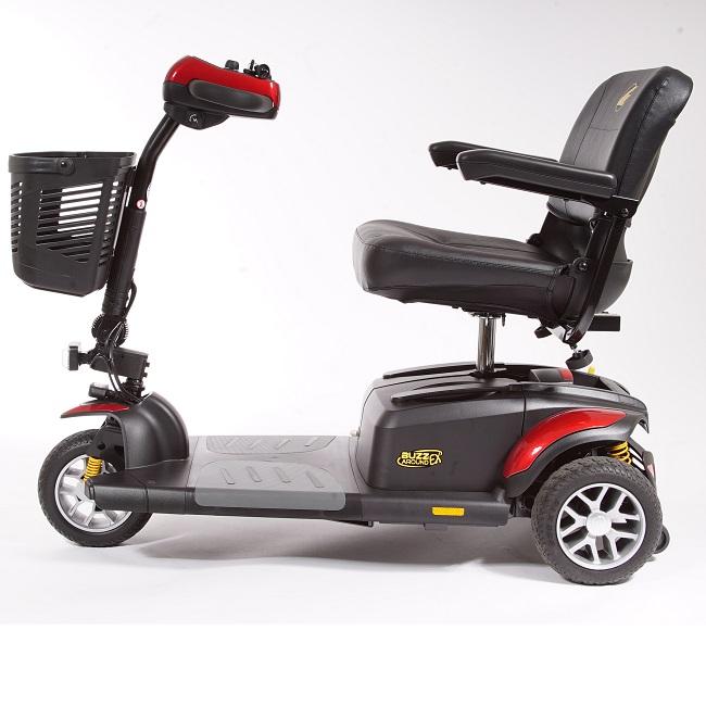 3-wheel electric mobility scooter in black and red with padded seat, armrests, tiller controls, and front basket