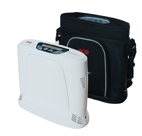 Portable oxygen concentrator shown beside its black soft-sided carrying case with shoulder strap