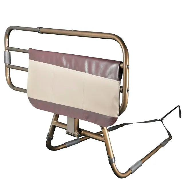 Bed rail with gold-tone tubular frame, padded burgundy and cream panel, folding base legs, and under-mattress securing strap