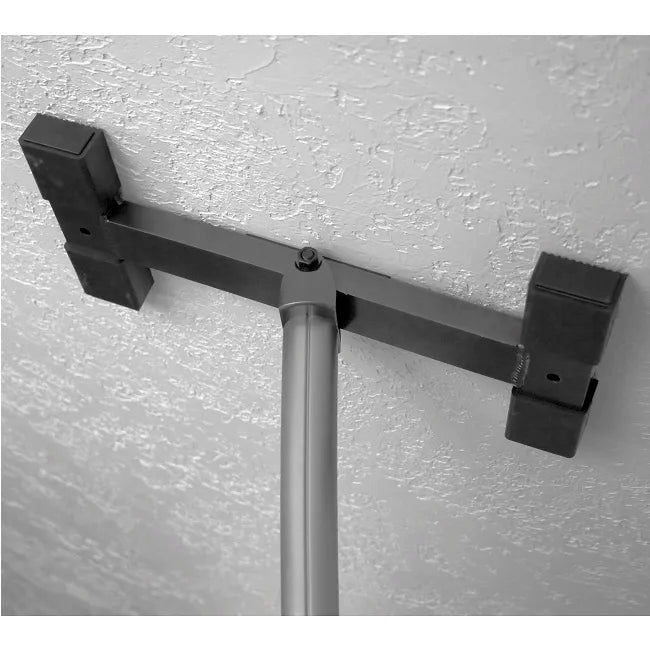 Floor-to-ceiling tension pole top section with adjustable horizontal crossbar and two padded grab handles against a wall