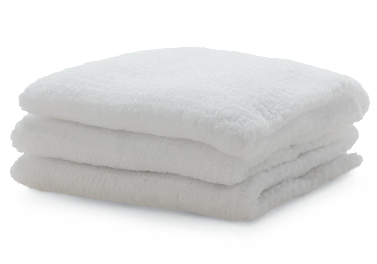 Washcloths, three white terry cloth squares folded and stacked on a white background