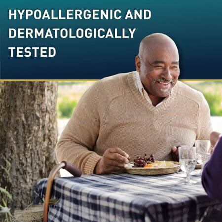 Adult absorbent underwear lifestyle image showing a smiling older man eating outdoors with a cane nearby, text reads