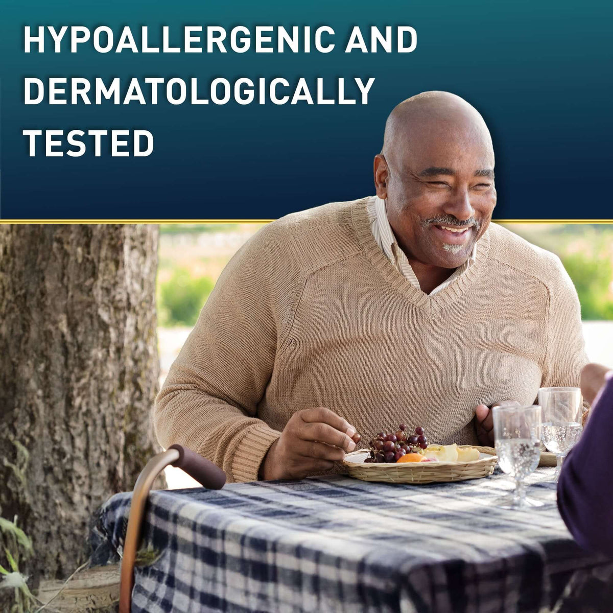 Adult absorbent underwear lifestyle image showing smiling older man dining outdoors with a cane nearby, text reads