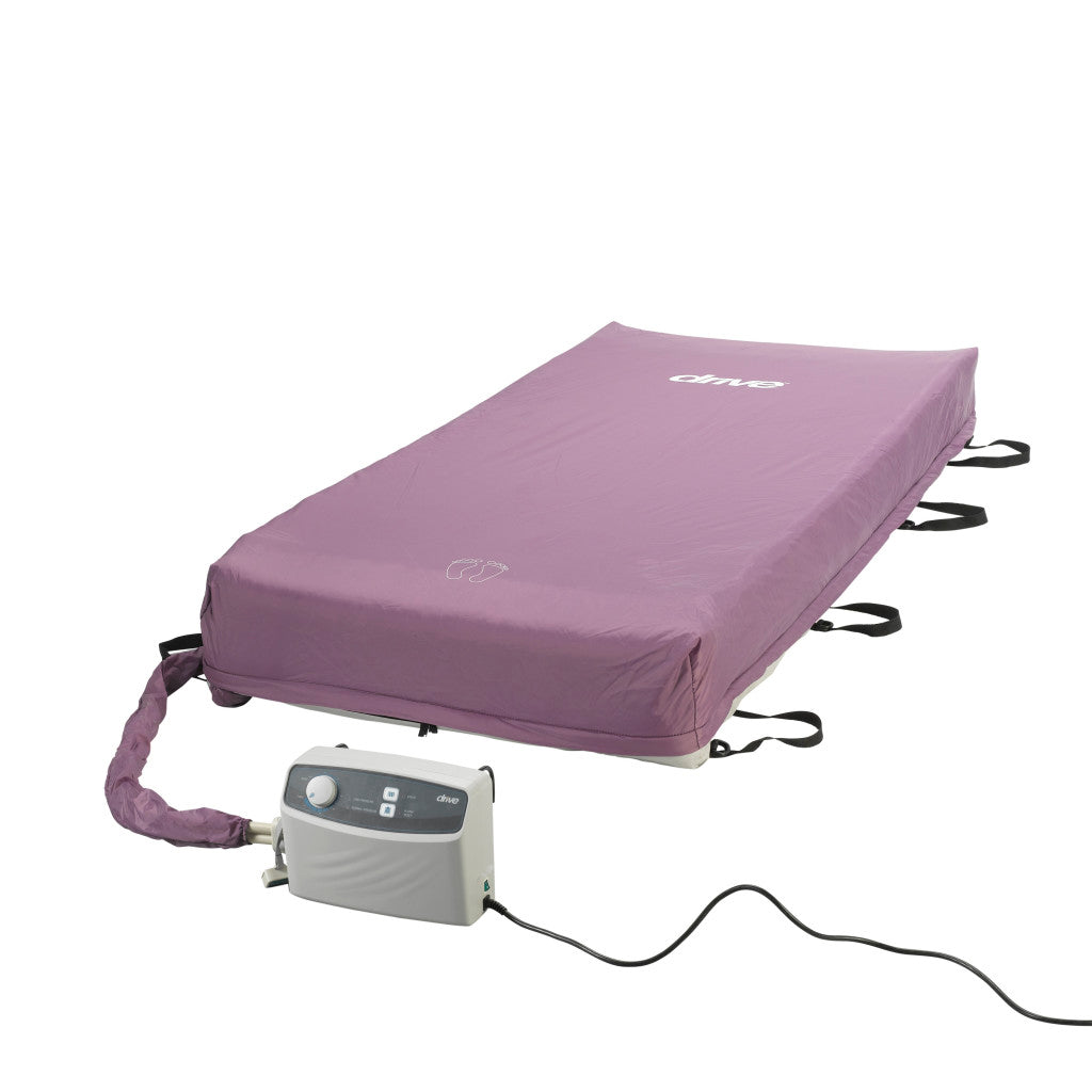 Alternating pressure mattress system with purple cover, side straps, and connected electric pump unit on white background