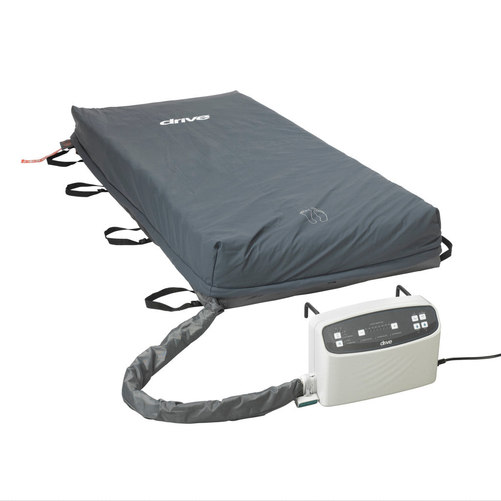 Alternating pressure mattress system with gray cover, side handles, and connected electronic pump control unit with digital