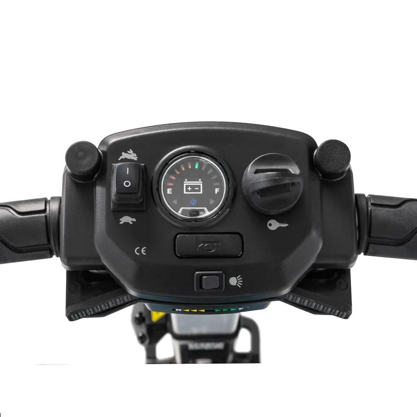 Mobility scooter tiller control panel with battery gauge, speed toggle, key switch, and handlebar grips, close-up view
