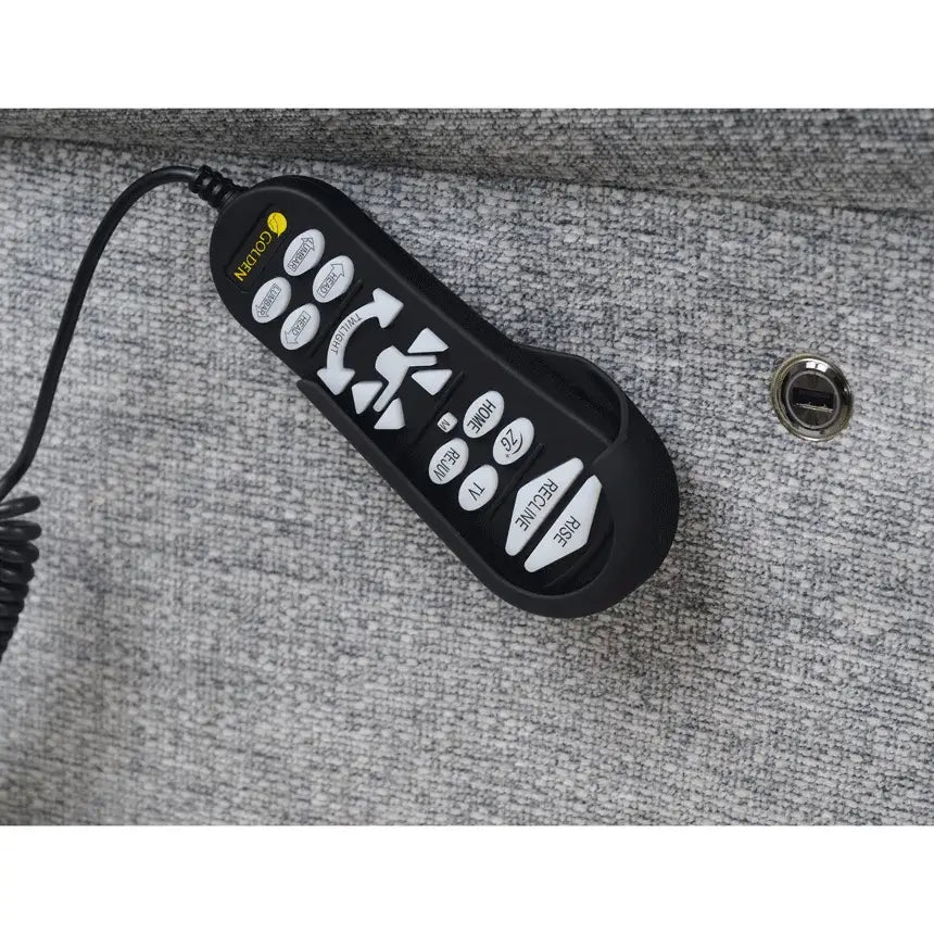 Lift chair hand remote control with multiple buttons including rise, recline, home, and TV positions, resting on gray fabric
